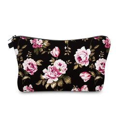 Trousse Aiphamy voyage fleurs ouverte montrant le rangement pratique dans le sac