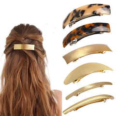 Barrettes AITELEI dorées en métal forme ovale, maintien élégant pour toute coiffure.