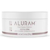 ALURAM Argile de coiffage packshot – flacon clair et texture prête à l'emploi.