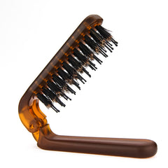 Brosse Ancable voyage pliable prête pour les déplacements.