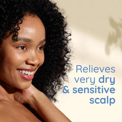 Aveeno Shampoing Apaisant – étiquette lisible indiquant les bénéfices.