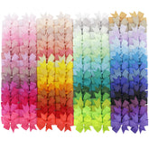Babymatch pinwheel bow on an alligator clip adds cute, secure styling for toddlers.