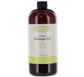 Banyan Botanicals huile de sésame, bouteille ambrée prête à nourrir la peau.