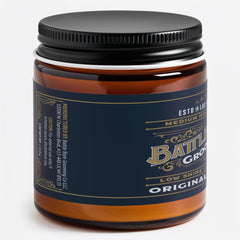 Battle Born Pomade Original, application au doigt, distribution facile et coiffage cohérent.