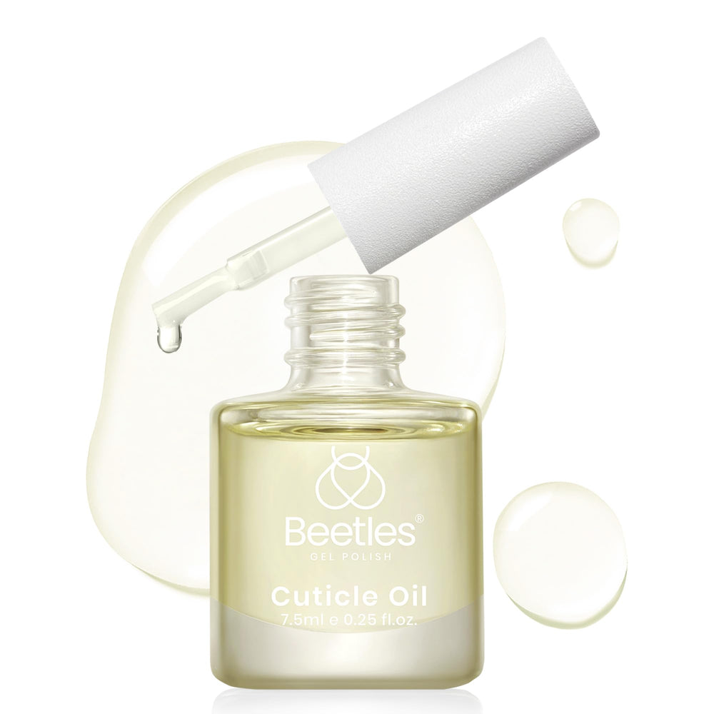 Beetles huile cuticule: bouteille et pinceau pour une application hydratante.