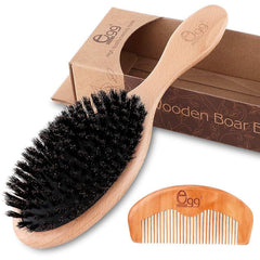 La brosse BLACK EGG avec poils de sanglier doux pour cheveux fins, mise en valeur.