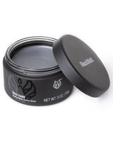 Texture naturelle et tenue durable avec la Pâte Black Wolf, pour tous types de cheveux.