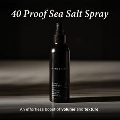 Applying Blind Barber spray to damp hair for lift from roots