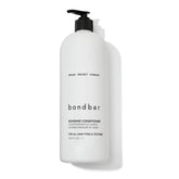 Bondbar Conditionneur: versement de la bouteille pour une hydratation rapide et démêlage facilité.