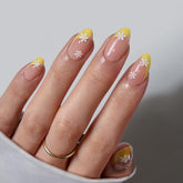 BTArtbox Daisy French-tip press-on nails in almond shape for quick at-home results.