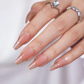 BTArtbox ongles a coller long avec contour rose dore pour un look élégant.