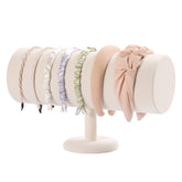 ByKen T-bar porte-bandeaux en velours beige, organise élégamment les accessoires.