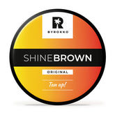 BYROKKO Shine Brown – Bouteille bronzage prête pour exposition solaire.