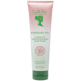 Masque fortifiant Camille Rose au romarin sur cheveux humides pour soutenir la croissance potentielle.