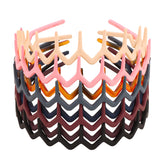 Canitor bandeau zigzag noir, maintien élégant et pratique pour cheveux fins.