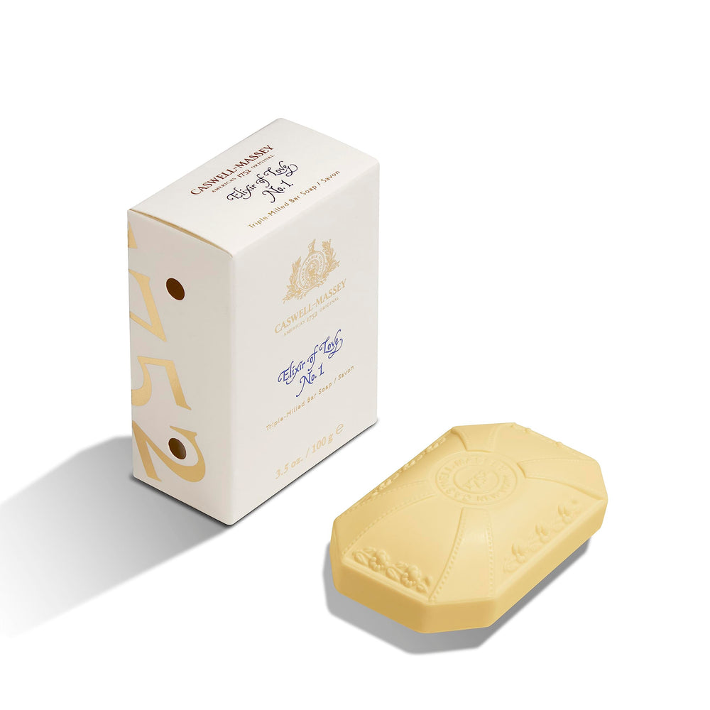 Caswell-Massey Elixir of Love bar soap close-up with rich lather and fragrance.