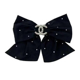Barrette ceyfey noeud noir et blanc avec perles pour une allure chic
