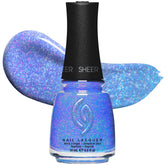 China Glaze Good Luxe Charm - Bouteille avec paillettes periwinkle, effet lumineux.