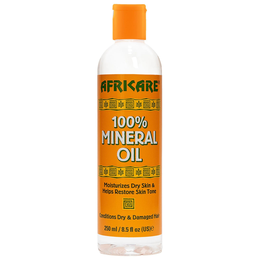 COCOCARE Africare – bouteille d'huile minérale pure pour hydrater peau et cheveux.