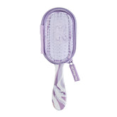 La brosse Knot Dr Conair violette, compacte et idéale pour démêler en voyage.