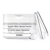 COSRX sérum traitement imperfections sur boule de coton pour application ciblée.
