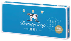 Savon Cow Brand bleu dans sa boîte, pratique pour la douche quotidienne.