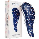 Brosse detanglante Crave Naturals Glide Thru, présentation du produit et design ergonomique.