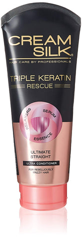 Cream Silk Triple Keratin Rescue Ultimate Straight Conditioner bottle pour for silky, manageable hair.
