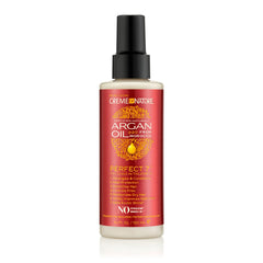 Bouteille Creme of Nature Perfect 7 montrant le soin sans rinçage pour tous types de cheveux.