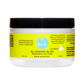 Curls Blueberry Bliss Masque réparateur, bouteille visible, soin profond pour cheveux nourris et protégés.
