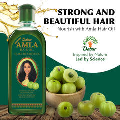 Dabur Amla Hair Oil, brillance-cheveux, nourri en profondeur pour un éclat lumineux.