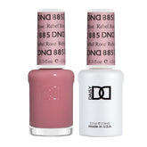 Daisy DND Rebel Rose gel polish swatch on nails, sheer coral red finish.