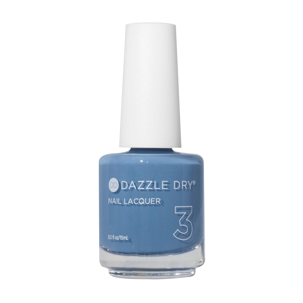 Vernis Dazzle Dry Varsity Blues dans sa bouteille, teinte denim légère.