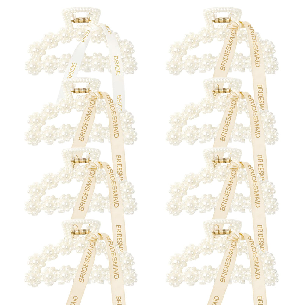 Barrette DEEKA avec perles blanches et ruban doré, idéale pour rehausser une coiffure.