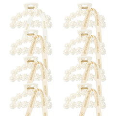 Barrette DEEKA avec perles blanches et ruban doré, idéale pour rehausser une coiffure.