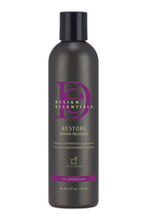 Bouteille Design Essentials Restore Vitamin prête à nourrir les cheveux secs.