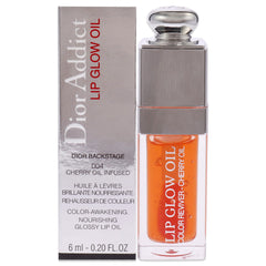 Dior Addict Lip Glow Oil, flacon corail, couleur lumineuse et brillance naturelle.