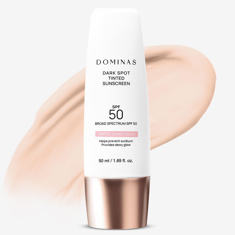 DOMINAS écran solaire teinté SPF50, bouteille élégante pour une protection quotidienne.