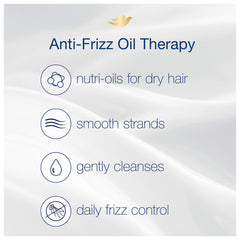 Flacon Dove Anti-Frizz posé dans la salle de bain.