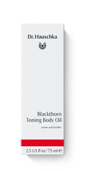 Dr. Hauschka huile tonifiante pour le corps — application sur peau nourrie et revitalisée.
