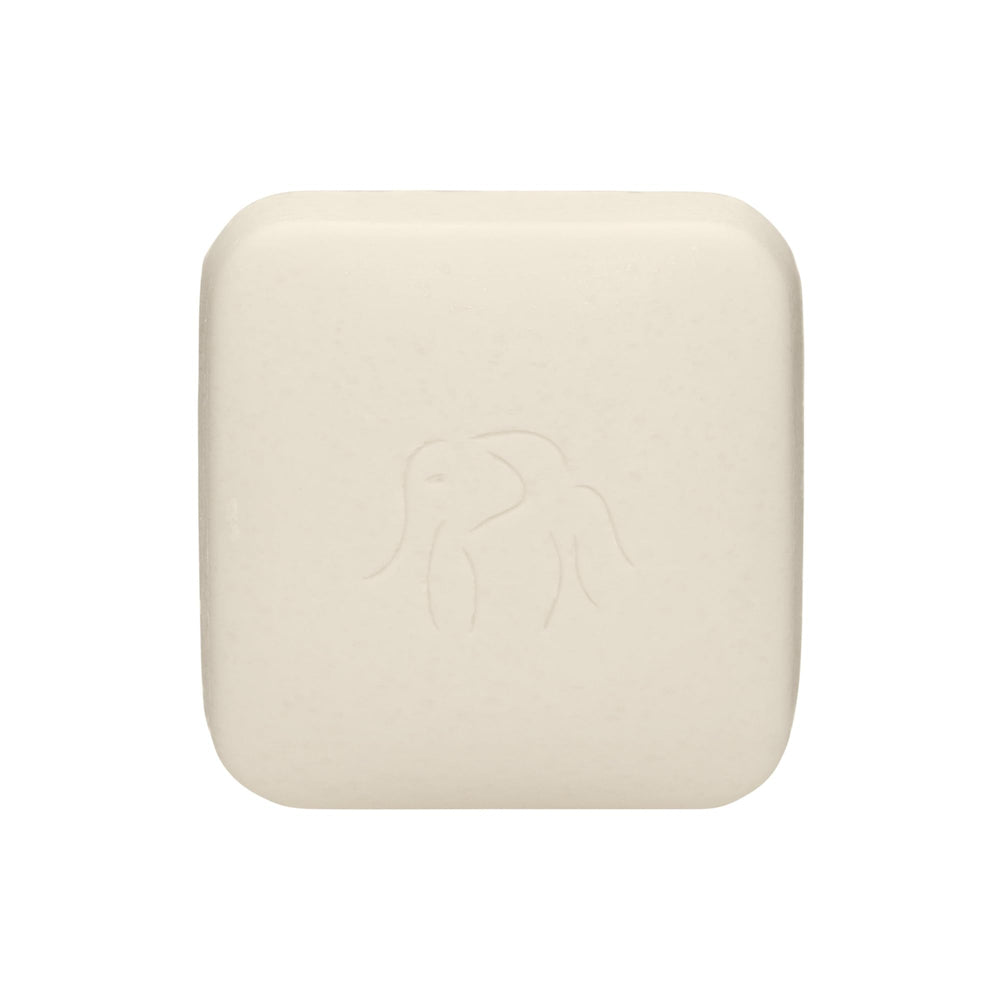 Drunk Elephant Pekee Bar nettoyant visage en action, texture crème pour une peau nettoyée en douceur