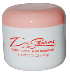 DuSharme conditioner hair dressing bottle demonstrates lightweight conditioning for glossy ends.