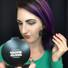 Elizabeth Mott Whatup Beaches Bronzer contouring cheeks and jawline with warm definition.