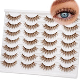 Cils EMEDA brun 14mm avec bande claire, regard naturel et posé rapidement.