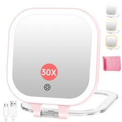 Miroir Fascinate voyage rose avec lumière LED pour maquillage précis en déplacement.