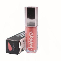 Fenty Beauty Gloss Bomb Color Drip 02 Fenty Glow sur packaging, couleur intense et longue tenue.