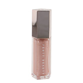 Fenty Beauty Gloss Bomb Sweetmouth sur bouteille lumineuse, brillance longue durée