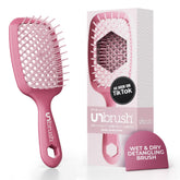 Brosse UNbrush de FHI Heat démonte les nœuds en douceur pour tous types de cheveux.