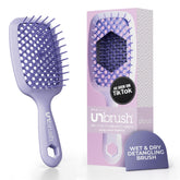 Brosse démêlante UNbrush de FHI Heat sur cheveux mouillés et secs, démêle sans douleur.
