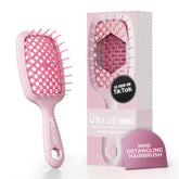 UNbrush mini de FHI Heat: brosse détanglante anti-statique pour démêler en douceur.